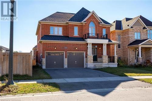 View of front of house with a garage - 1174 Upper Thames Drive, Woodstock, ON - Outdoor With Facade