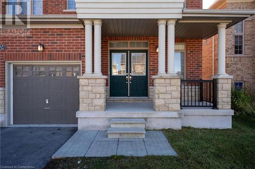 Entrance to property with a garage and covered porch - 1174 Upper Thames Drive, Woodstock, ON - Outdoor With Deck Patio Veranda