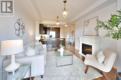 310 - 539 Belmont Avenue W, Kitchener, ON - Indoor Photo Showing Living Room With Fireplace