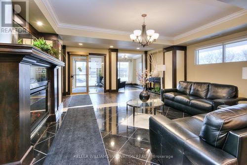 310 - 539 Belmont Avenue W, Kitchener, ON - Indoor Photo Showing Living Room With Fireplace