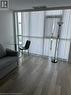 Living room featuring dark hardwood / wood-style floors - 560 North Service Road Unit# 211, Grimsby, ON  - Indoor 