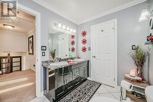 Bathroom featuring ceiling fan, vanity, tile patterned floors, and ornamental molding - 2378 Headon Road, Burlington, ON - Indoor Photo Showing Bathroom