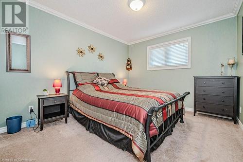 Bedroom featuring a textured ceiling, light carpet, and crown molding - 2378 Headon Road, Burlington, ON - Indoor Photo Showing Bedroom