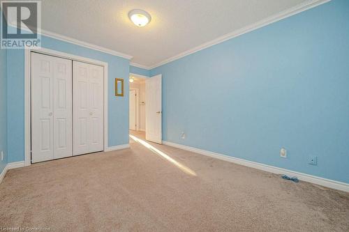 3rd bedroom featuring ornamental molding, carpet, and a textured ceiling - 2378 Headon Road, Burlington, ON - Indoor Photo Showing Other Room