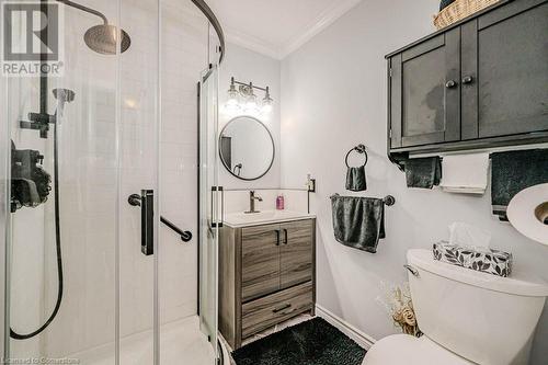 Updated Bathroom featuring crown molding, an enclosed shower, vanity, and toilet - 2378 Headon Road, Burlington, ON - Indoor Photo Showing Bathroom