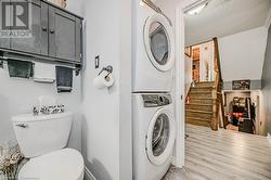 stacked washer and clothes dryer in 3 pc bathroom. - 