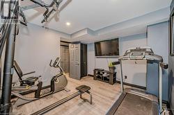 Workout area with vinyl flooring. Potential 4th bedroom. - 