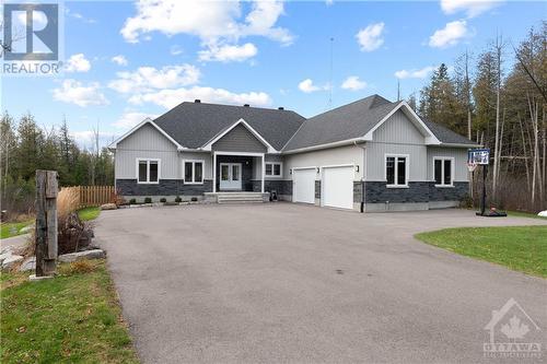 fully paved drive, with extra parking for toys too! - 875 Deertail Lane, Ottawa, ON - Outdoor With Facade