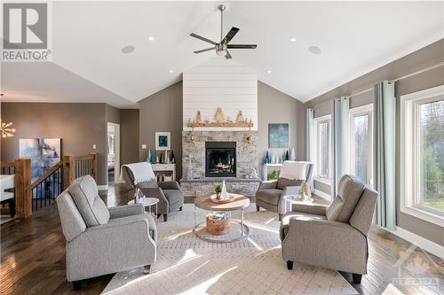 cozy gas fireplace - 875 Deertail Lane, Ottawa, ON - Indoor Photo Showing Living Room With Fireplace