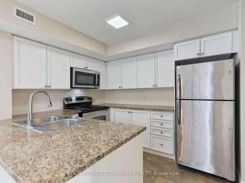 1105-335 Rathburn Rd W, Mississauga, ON - Indoor Photo Showing Kitchen With Double Sink