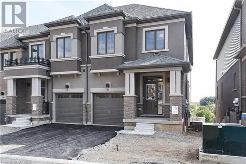 Prairie-style house featuring a balcony and a garage - 620 Colborne Street W Unit# 42, Brantford, ON - Outdoor With Balcony With Facade