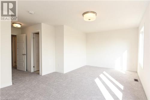 Empty room with light colored carpet - 620 Colborne Street W Unit# 42, Brantford, ON - Indoor Photo Showing Other Room