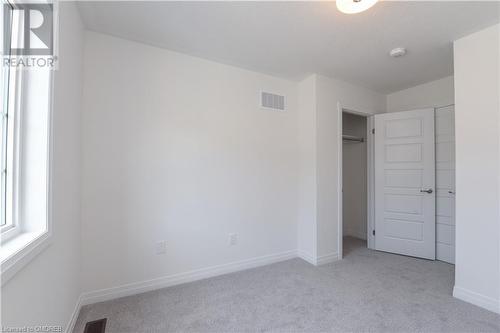 Unfurnished bedroom featuring a closet and light carpet - 620 Colborne Street W Unit# 42, Brantford, ON - Indoor Photo Showing Other Room