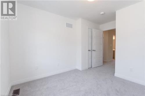 View of carpeted empty room - 620 Colborne Street W Unit# 42, Brantford, ON - Indoor Photo Showing Other Room