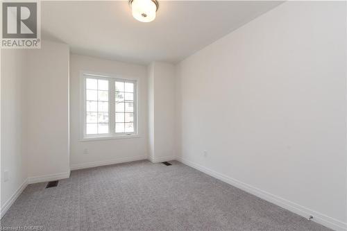 View of carpeted empty room - 620 Colborne Street W Unit# 42, Brantford, ON - Indoor Photo Showing Other Room