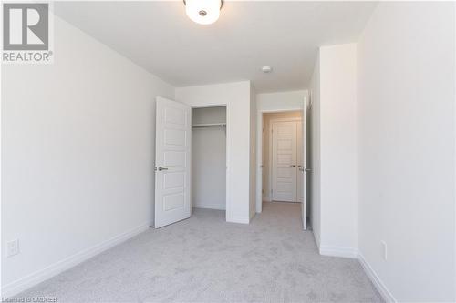 Unfurnished bedroom featuring light colored carpet and a closet - 620 Colborne Street W Unit# 42, Brantford, ON - Indoor Photo Showing Other Room