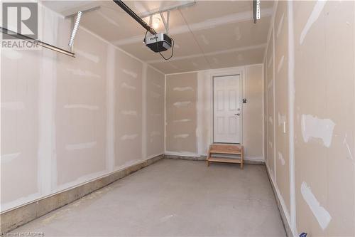 Garage featuring a garage door opener - 620 Colborne Street W Unit# 42, Brantford, ON - Indoor