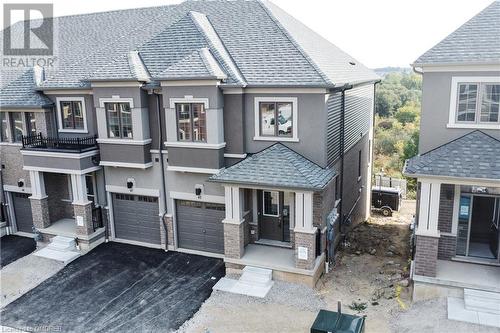 View of front of home with a garage - 620 Colborne Street W Unit# 42, Brantford, ON - Outdoor With Facade