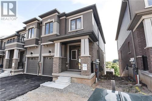 View of front of house featuring a garage - 620 Colborne Street W Unit# 42, Brantford, ON - Outdoor With Facade