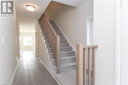 Stairway featuring hardwood / wood-style flooring - 