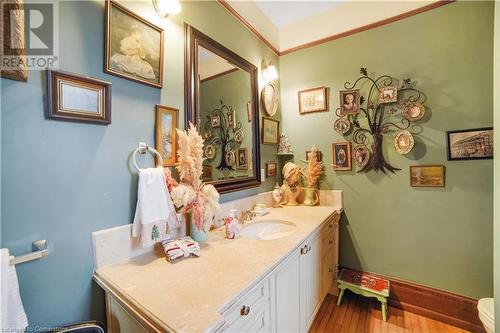 Bathroom featuring vanity and hardwood / wood-style flooring - 687 Highway 6 Highway, Caledonia, ON - Indoor Photo Showing Bathroom