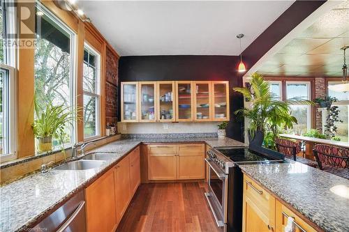 Kitchen featuring stainless steel appliances, sink, and plenty of natural light - 687 Highway 6 Highway, Caledonia, ON - Indoor Photo Showing Kitchen With Double Sink