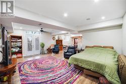 Bedroom featuring french doors and light hardwood / wood-style floors - 