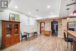 Misc room featuring light hardwood / wood-style floors and brick wall - 