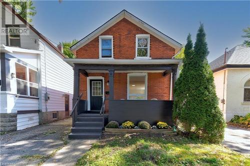 View of front of property featuring a porch - 233 Nile Street, Stratford, ON - Outdoor With Facade