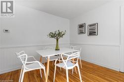 Dining room featuring wood-type flooring - 