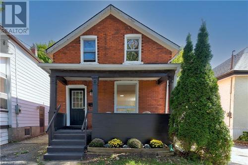 View of front facade featuring covered porch - 233 Nile Street, Stratford, ON - Outdoor