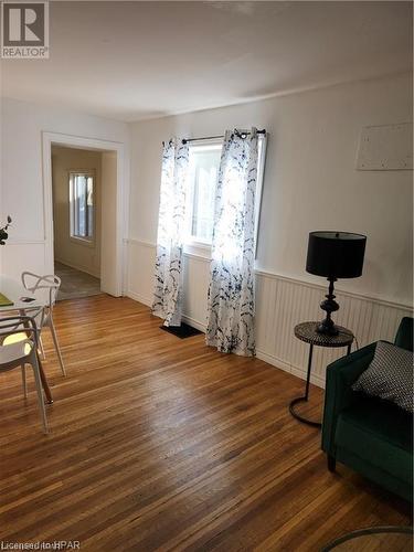 Sitting room featuring wood-type flooring and plenty of natural light - 233 Nile Street, Stratford, ON - Indoor