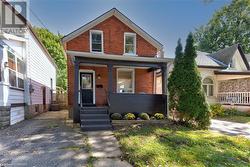 View of front of home featuring covered porch - 