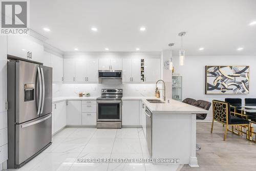 210 - 7440 Bathurst Street, Vaughan, ON - Indoor Photo Showing Kitchen With Double Sink With Upgraded Kitchen