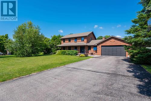 71 Nicholson Crescent, Springwater, ON - Outdoor With Facade