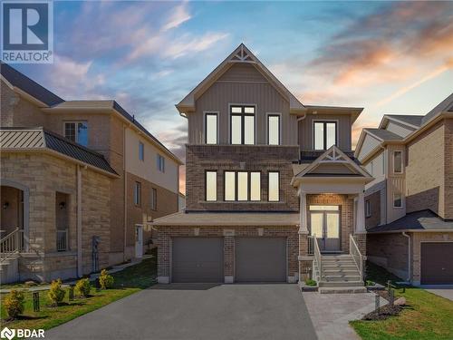 View of front of home with a garage - 3046 Stone Ridge Boulevard, Orillia, ON - Outdoor With Facade