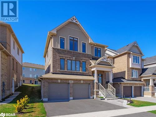 Townhome / multi-family property featuring a garage - 3046 Stone Ridge Boulevard, Orillia, ON - Outdoor With Facade