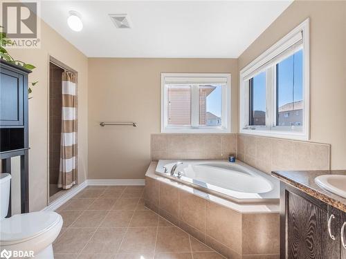 Full bathroom with toilet, plus walk in shower, vanity, and tile patterned flooring - 3046 Stone Ridge Boulevard, Orillia, ON - Indoor Photo Showing Bathroom