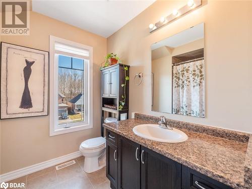 Bathroom with tile patterned flooring, vanity, toilet, and vaulted ceiling - 3046 Stone Ridge Boulevard, Orillia, ON - Indoor Photo Showing Bathroom