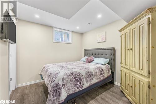 Bedroom featuring dark wood-type flooring - 3046 Stone Ridge Boulevard, Orillia, ON - Indoor Photo Showing Bedroom