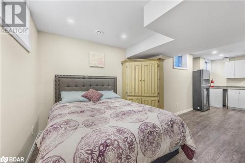 Bedroom featuring light wood-type flooring and stainless steel fridge - 3046 Stone Ridge Boulevard, Orillia, ON - Indoor Photo Showing Bedroom