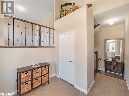 Stairs featuring lofted ceiling and tile patterned floors - 3046 Stone Ridge Boulevard, Orillia, ON - Indoor Photo Showing Other Room