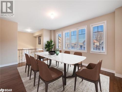 Dining room featuring dark wood-type flooring - 3046 Stone Ridge Boulevard, Orillia, ON - Indoor Photo Showing Dining Room