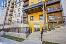 View of building exterior - 8 Culinary Lane Unit# 402, Barrie, ON  - Outdoor With Balcony 