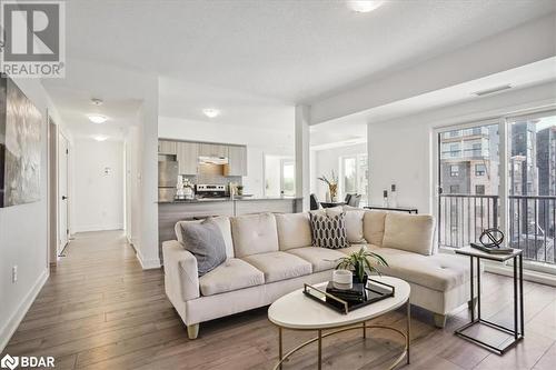 Living room featuring light wood-type flooring - 8 Culinary Lane Unit# 402, Barrie, ON - Indoor Photo Showing Living Room