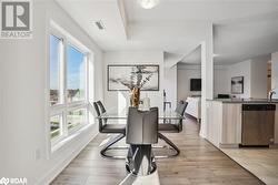 Dining area featuring a wealth of natural light, light hardwood / wood-style floors, and sink - 