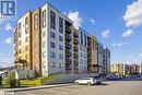 View of building exterior - 8 Culinary Lane Unit# 402, Barrie, ON  - Outdoor With Balcony With Facade 