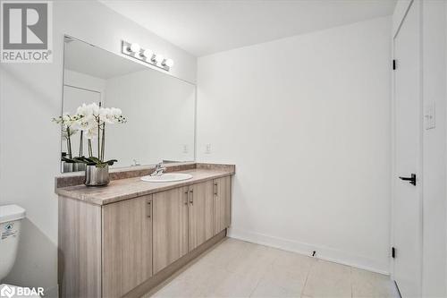 Bathroom featuring toilet and vanity - 8 Culinary Lane Unit# 402, Barrie, ON - Indoor Photo Showing Bathroom