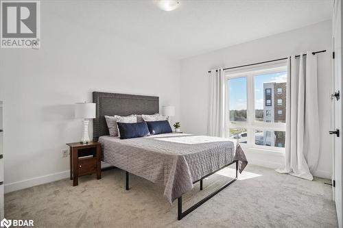 Bedroom with light carpet - 8 Culinary Lane Unit# 402, Barrie, ON - Indoor Photo Showing Bedroom