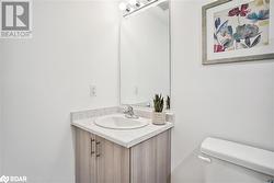 Bathroom featuring vanity and toilet - 